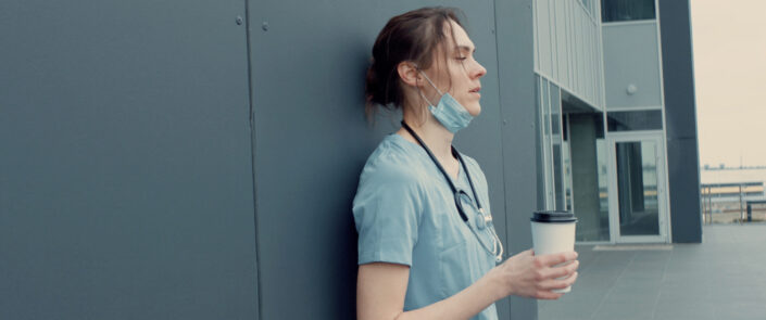 Portrait,Of,Tired,Exhausted,Nurse,Or,Doctor,Having,A,Coffee